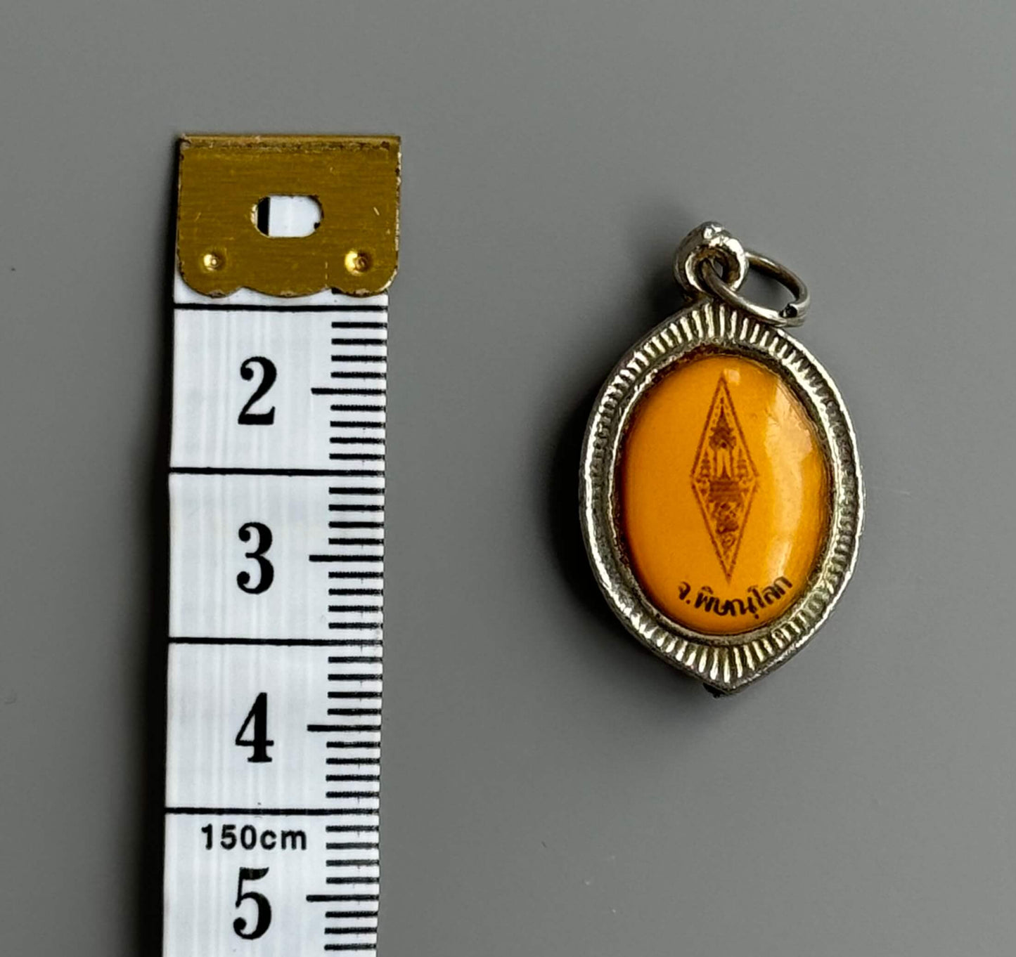 Phra Buddha Chinnarat Encased Amulet